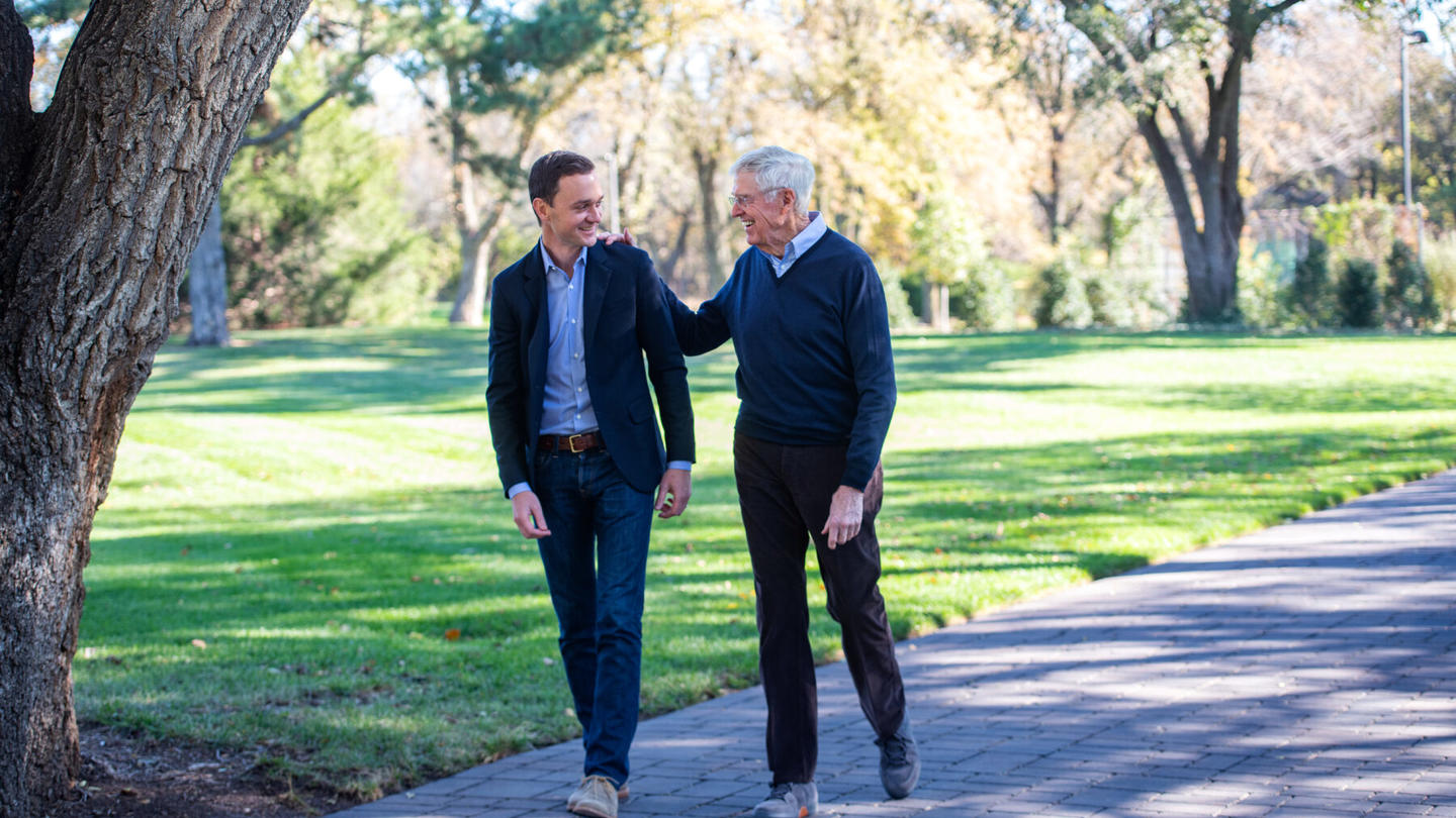 Charles Koch and Brian Hooks walking together