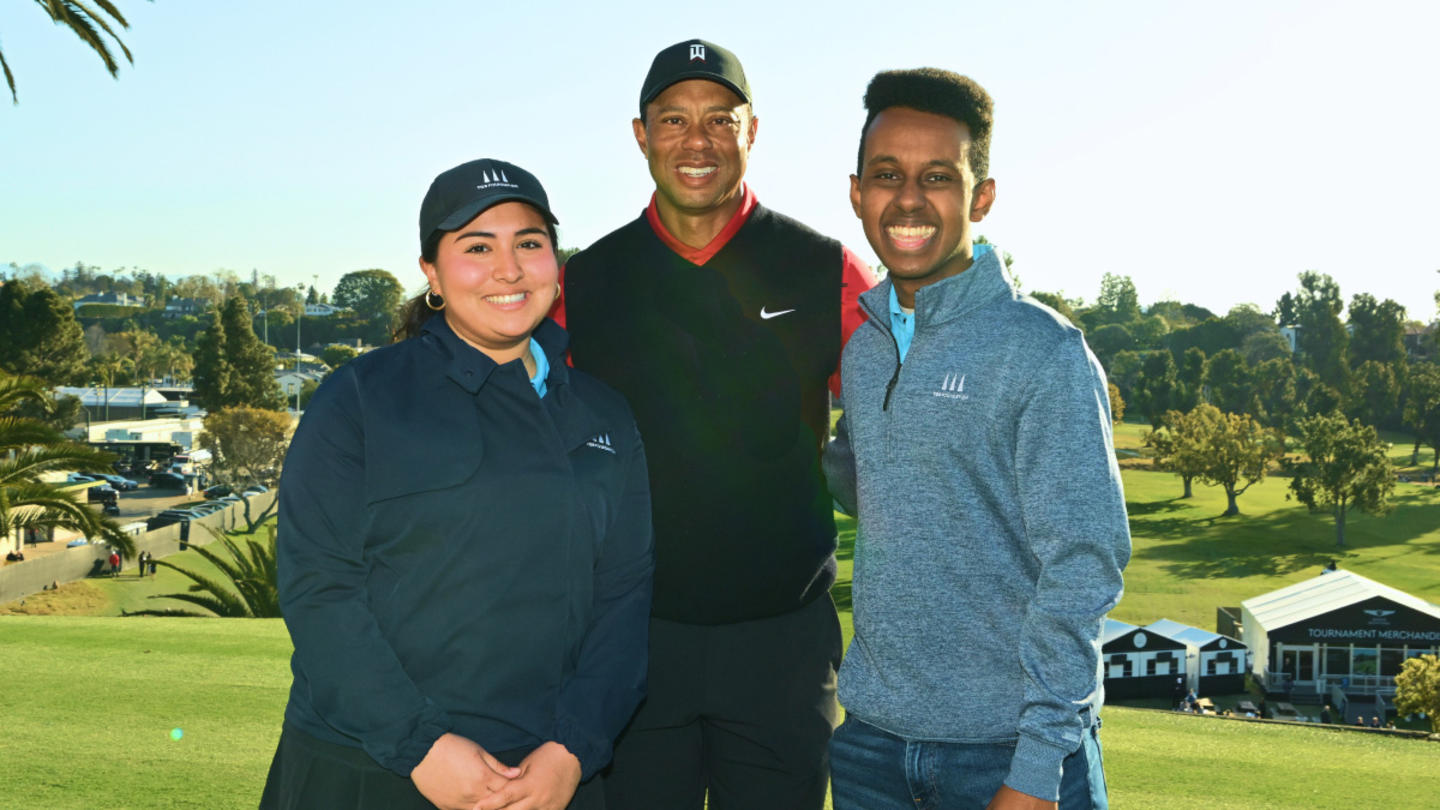 Tiger Woods with two TGR Learning Labs students