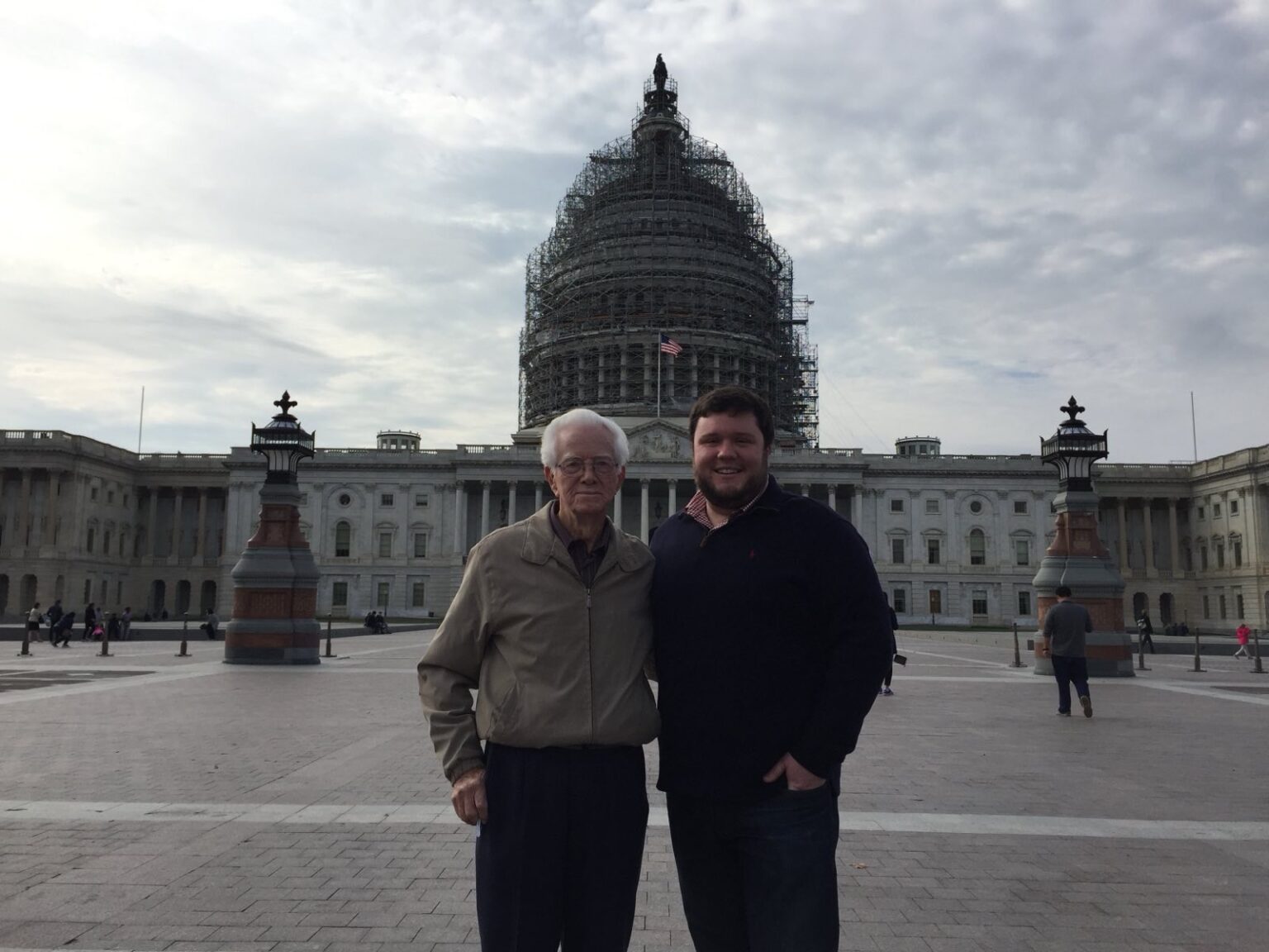 A picture of Tyler Gay with his grandfather in front of the U.S. Capitol building
