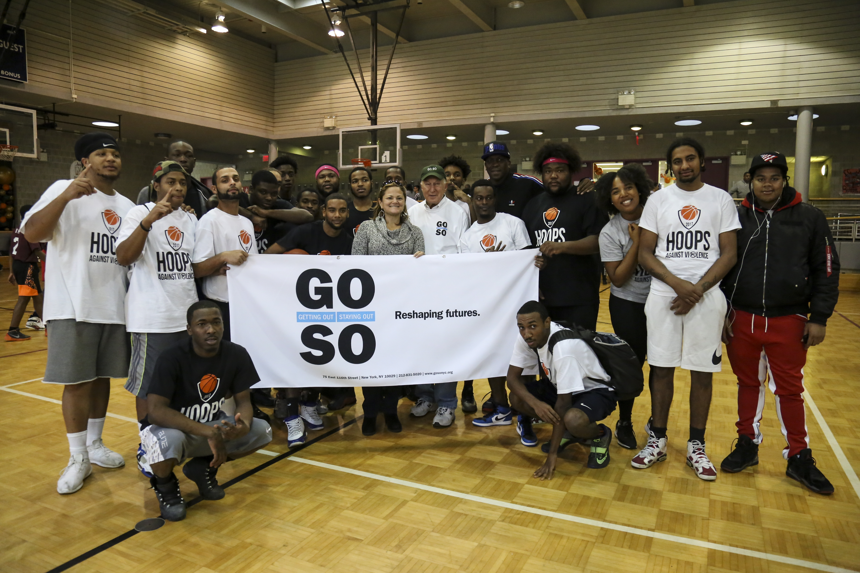 A group of Getting Out and Staying Out program participants in a gymnasium