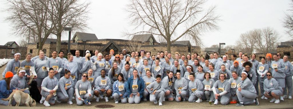 A group photo of race participants and volunteers