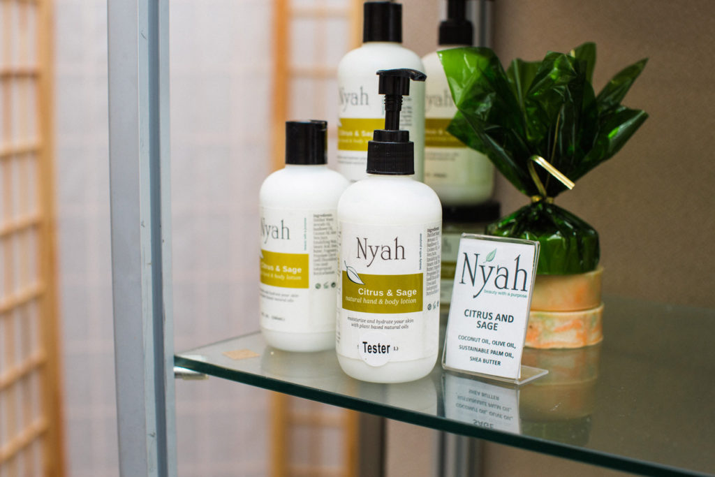 Nyah products on a glass shelf