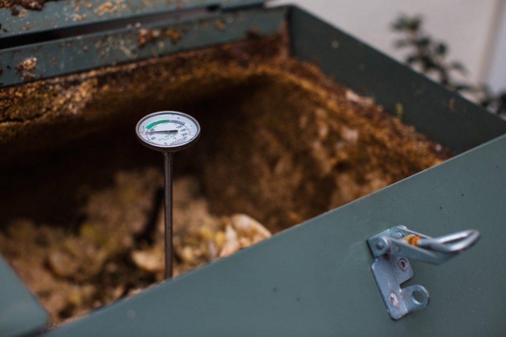 A gauge inside a composting bin
