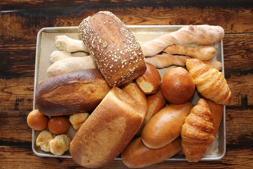 A variety of breads on a baking sheet