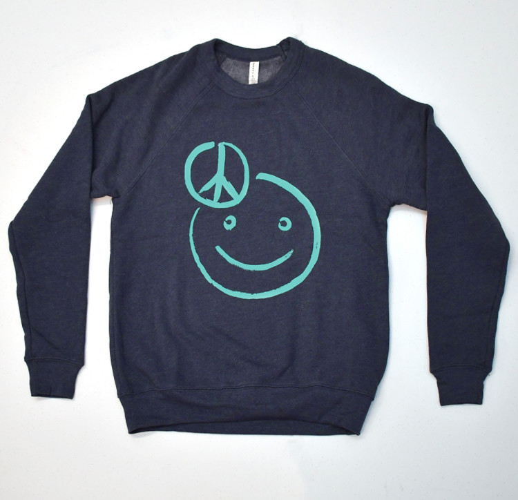 A long sleeve t-shirt with a peace sign and happy face on it