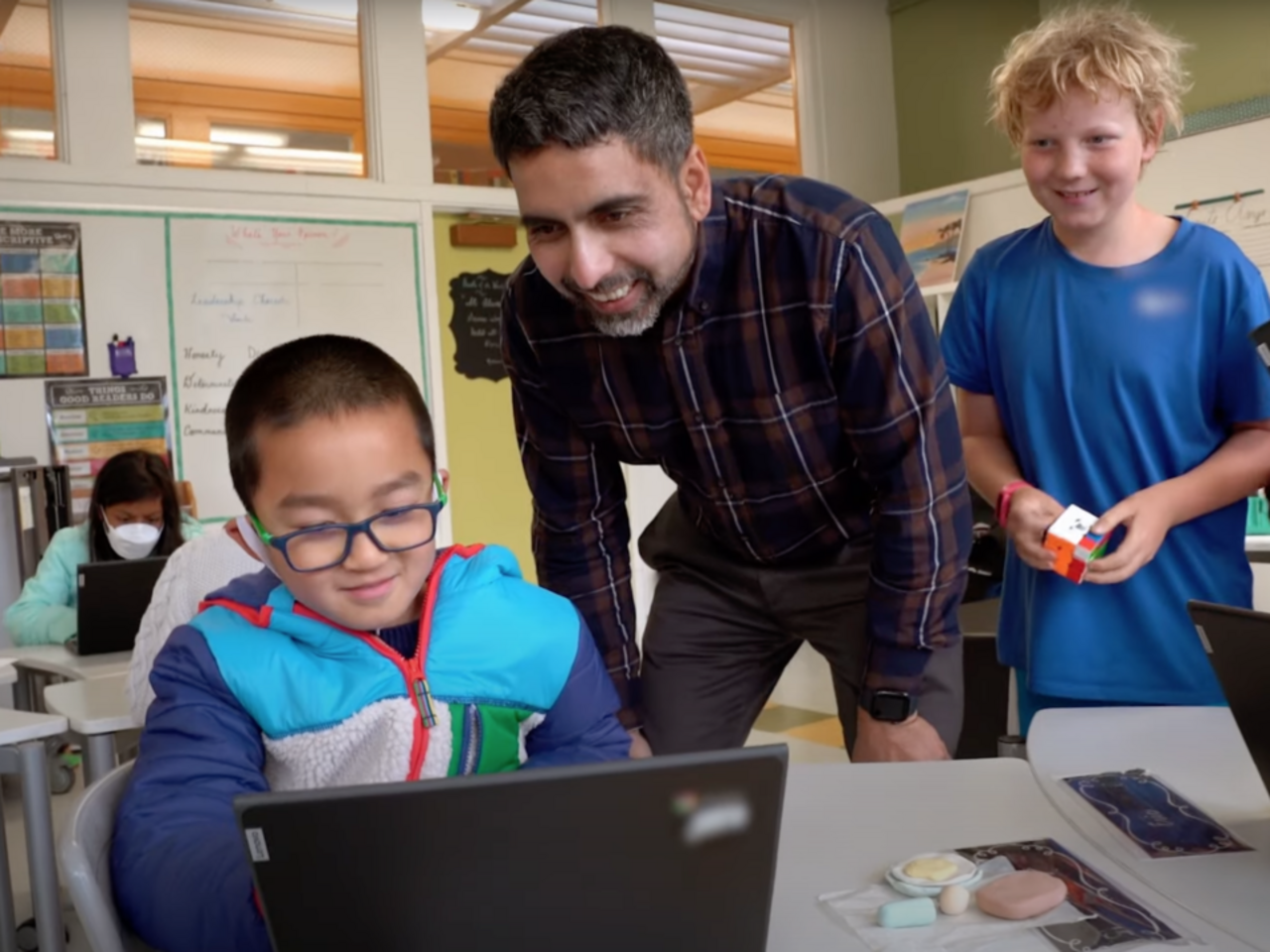 Sal Khan and two young male students