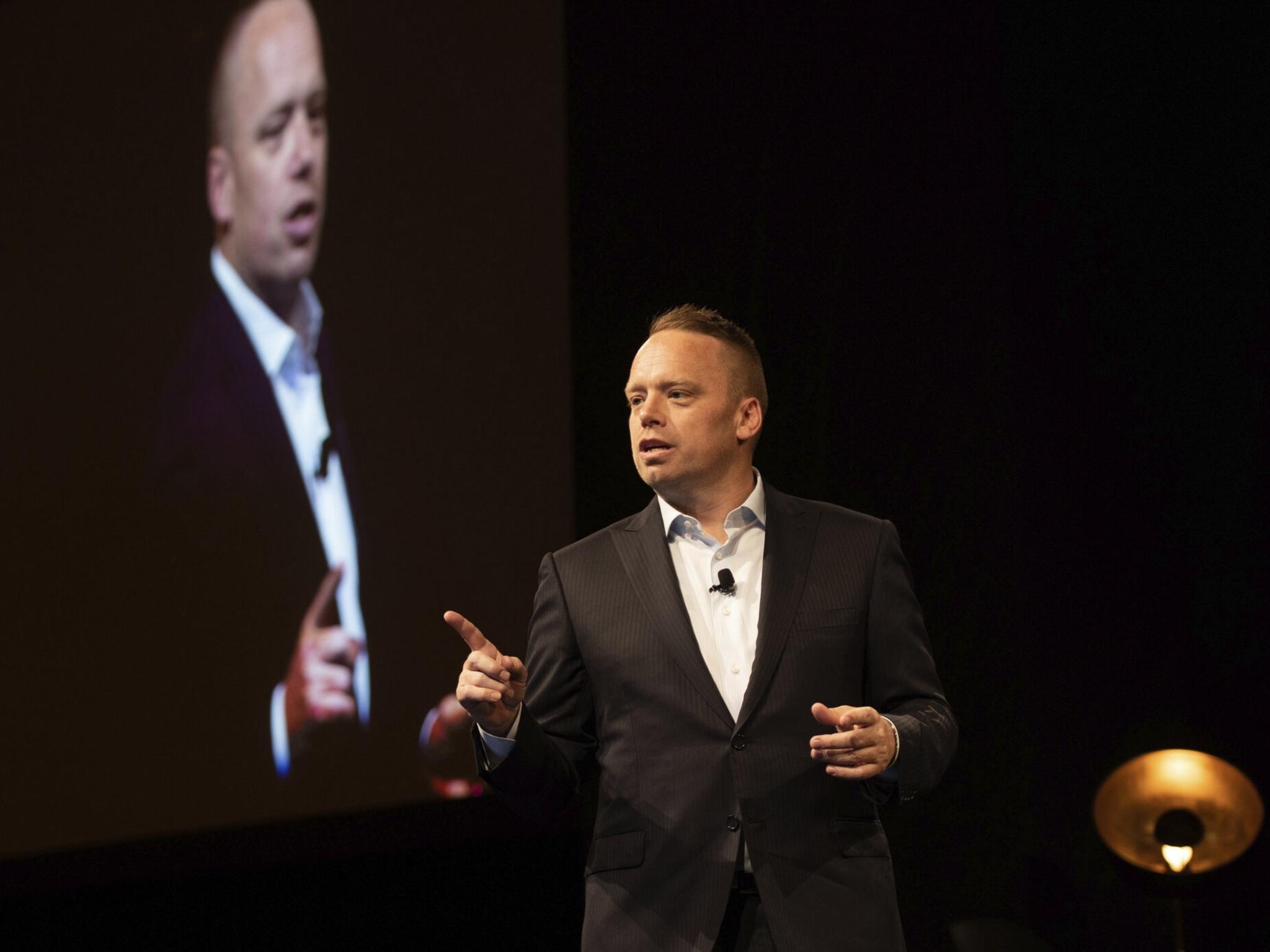 Todd Rose speaks on stage at a conference.
