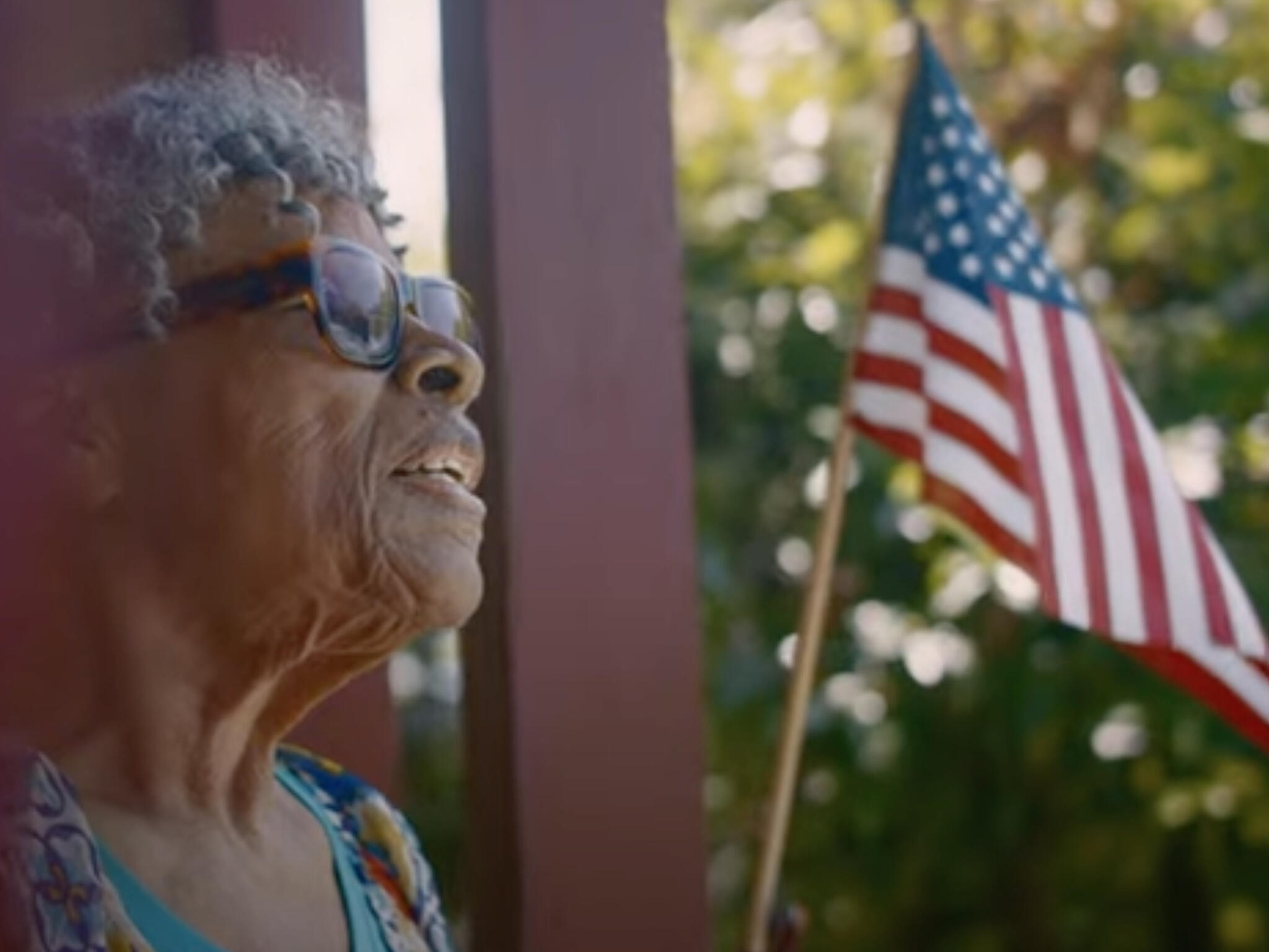 Opal Lee photographed standing in front of an American flag