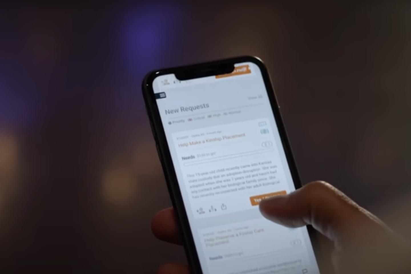 A person using the CarePortal app on their iPhone.