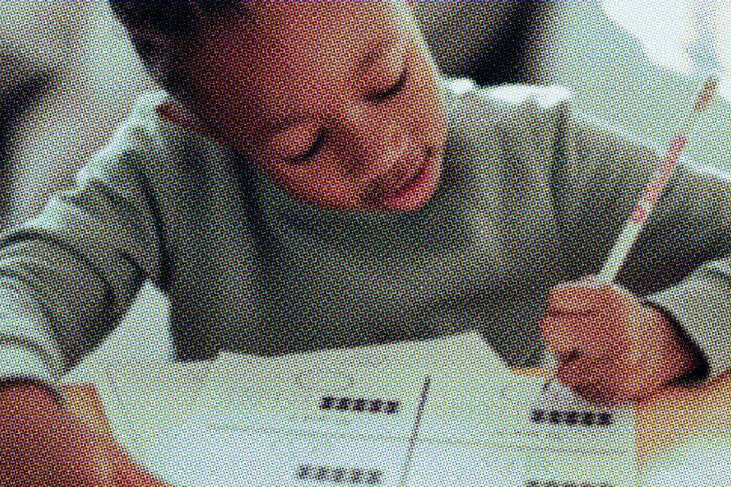 A child at Canary Academy working on an assignment