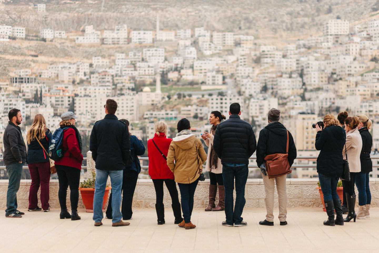 Telos Group members gathered looking over a foreign city