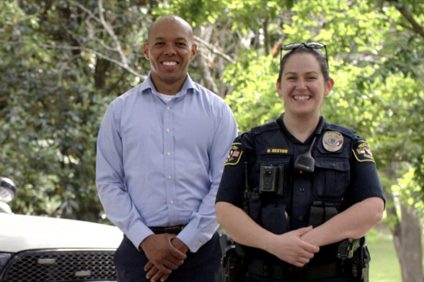 Officer and African American man smiling