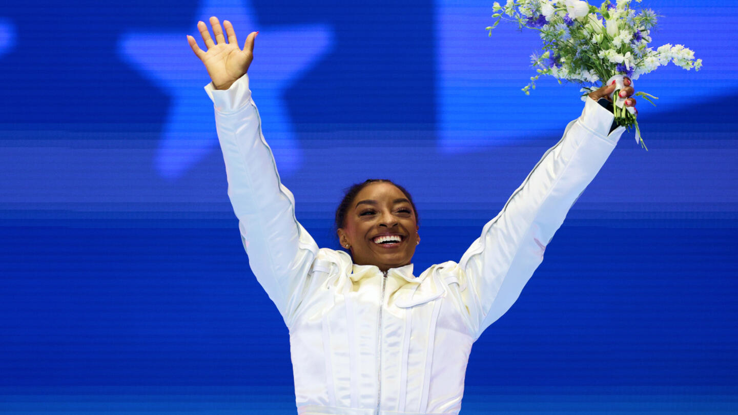 Simone Biles celebrates after winning