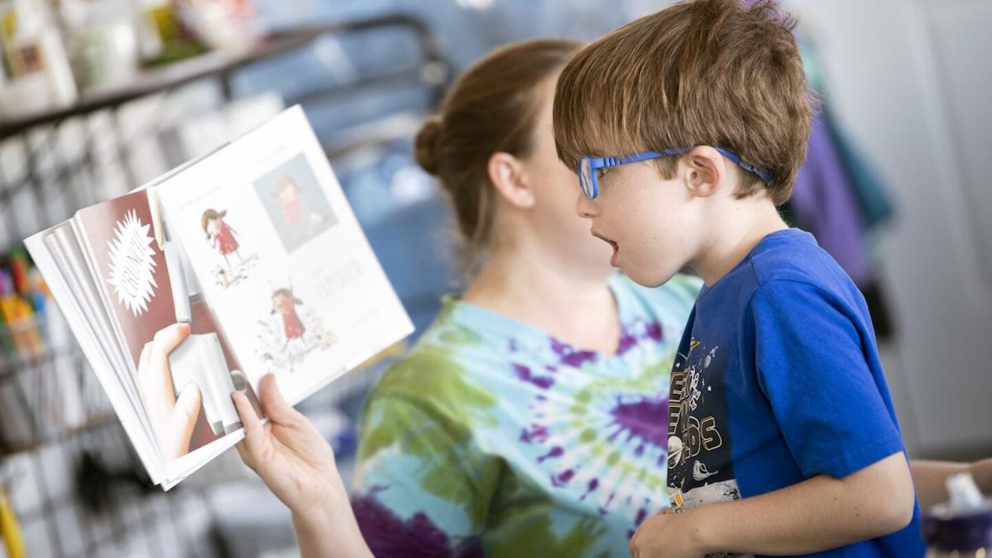 A student looking at awe in a book, showing student engagement strategies that work