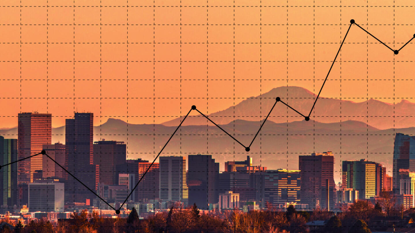 A skyline with a graph overlaid. The whole image is orange and black