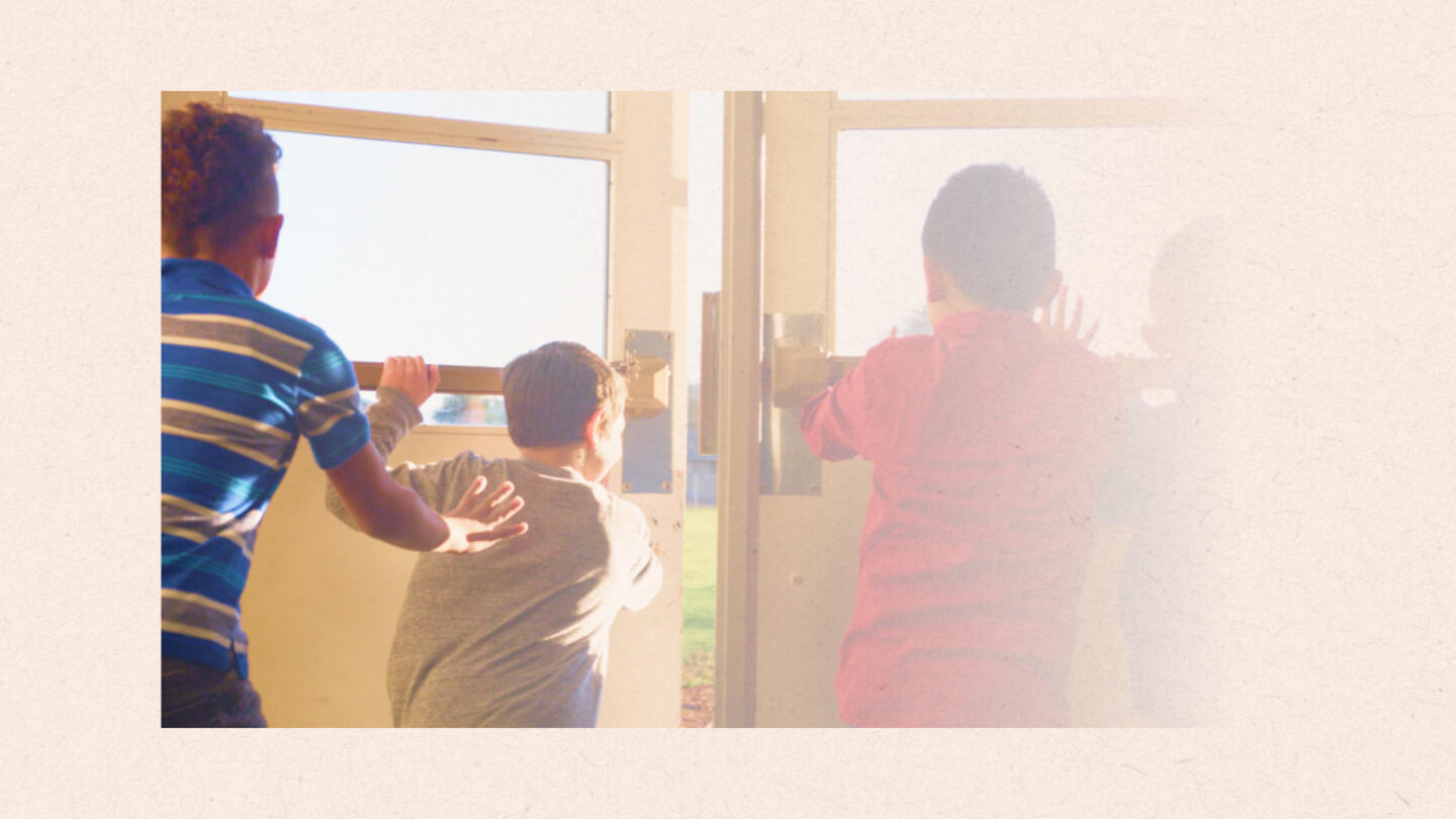 A photo with a gradiant fade from left to right of four young students pushing a door open to go outside