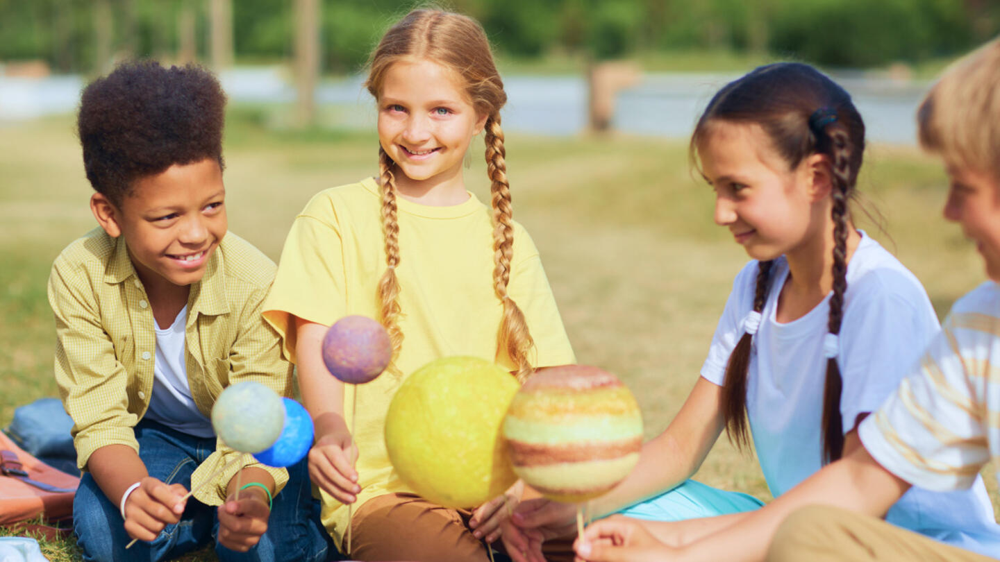 A group of children playing together outside