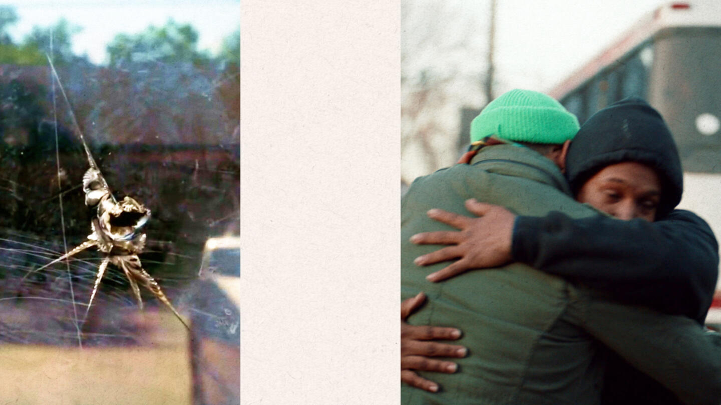 Hole in glass with two people hugging.