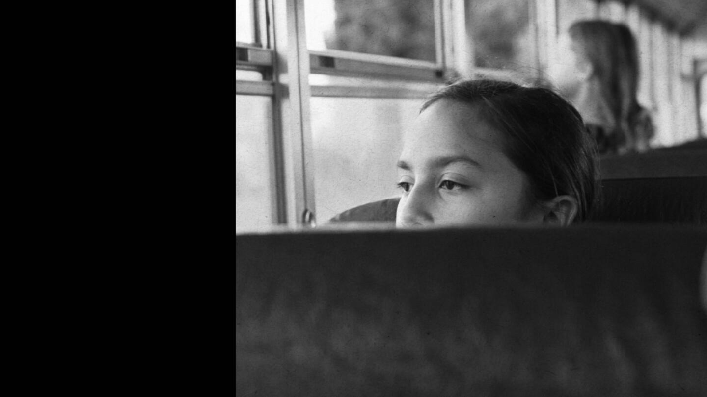 Student sitting on school bus
