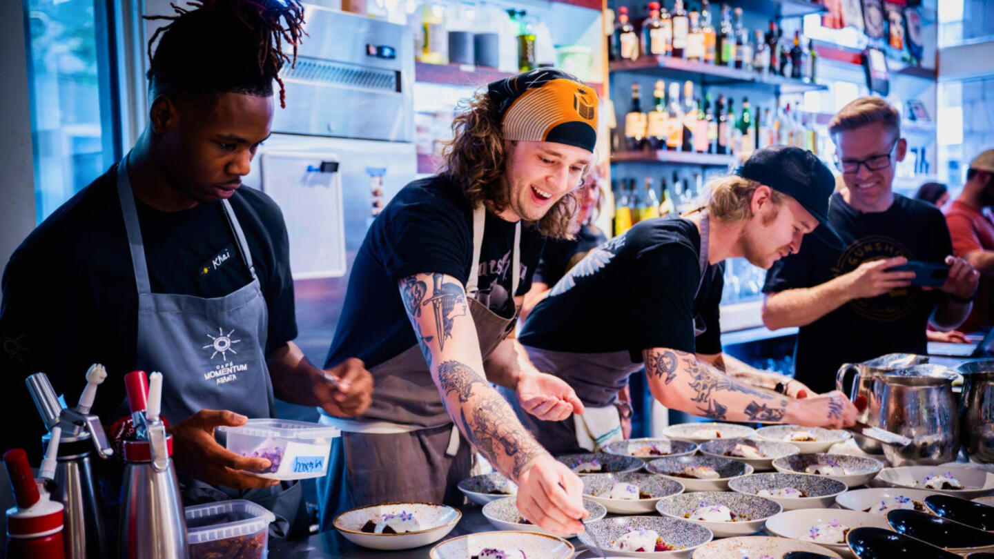 Youth preparing food at a restaurant. 