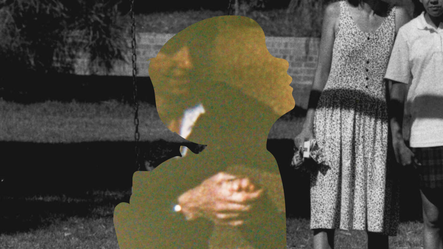 Black and white image of people and a child.