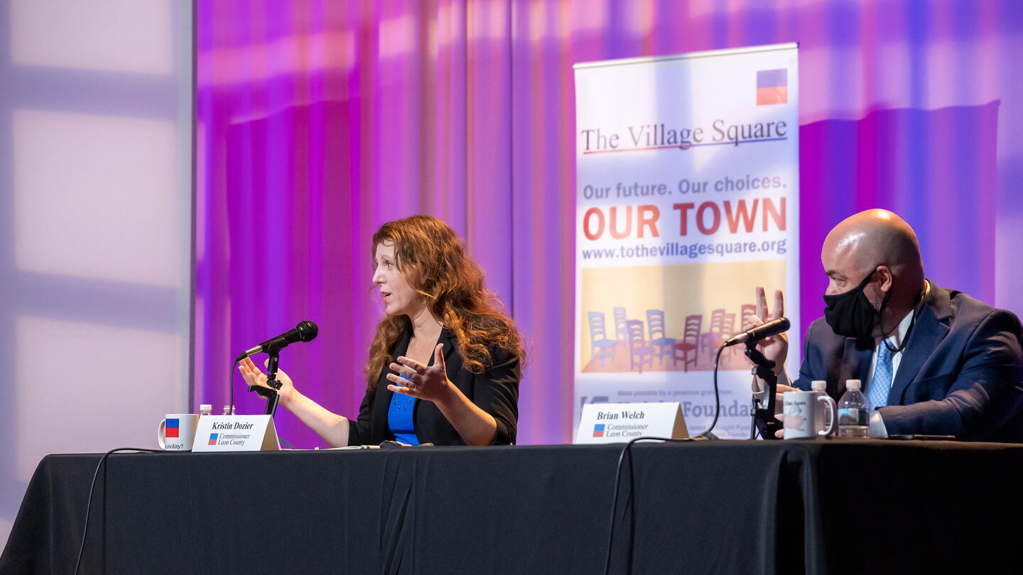 Kristin Dozier speaks at a The Village Square Event