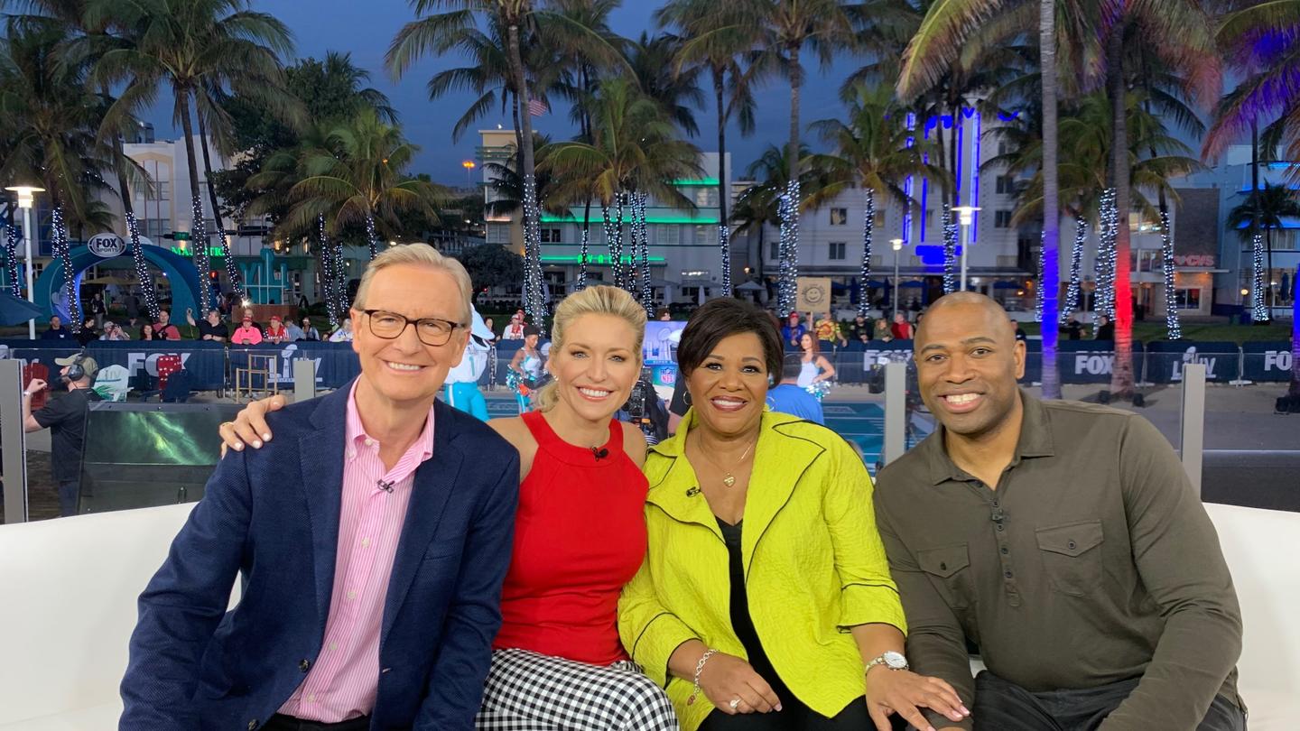 Fox and Friends hosts pose with Alice Marie Johnson on a couch outdoors in Miami