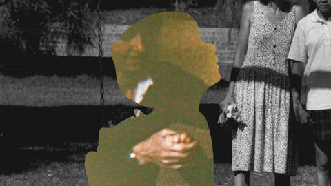 Black and white image of people and a child.