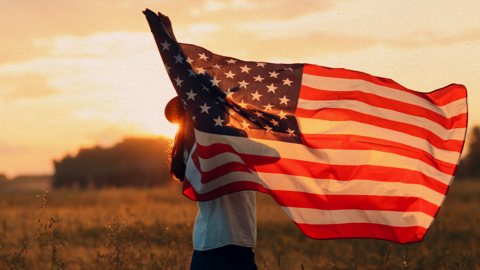 A person holding the American flag.