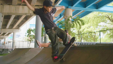 Kid riding a skateboard at the skate park.