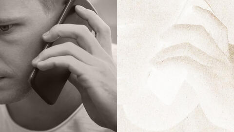Man holding a phone to his ear.