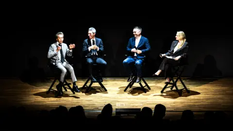 Panel speaking at an event.