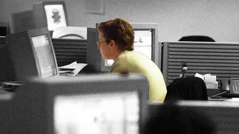 Worker sitting at their desk in the office.