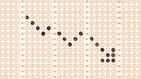 Scantron test with a downward arrow.