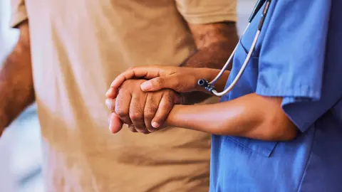 Health care worker with a patient.