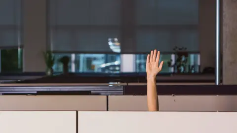 Employee raising their hand.