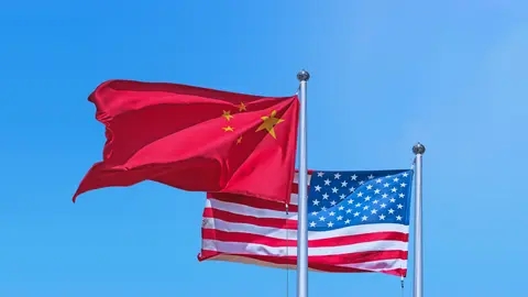 Photo showing an American flag and a Chinese flag.