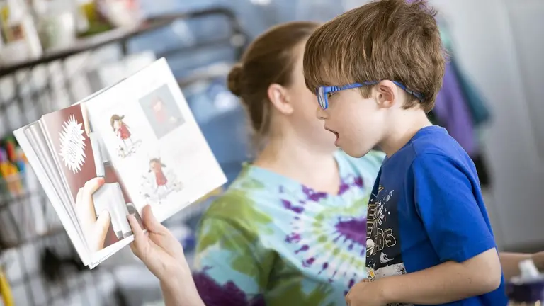 A student looking at awe in a book, showing student engagement strategies that work