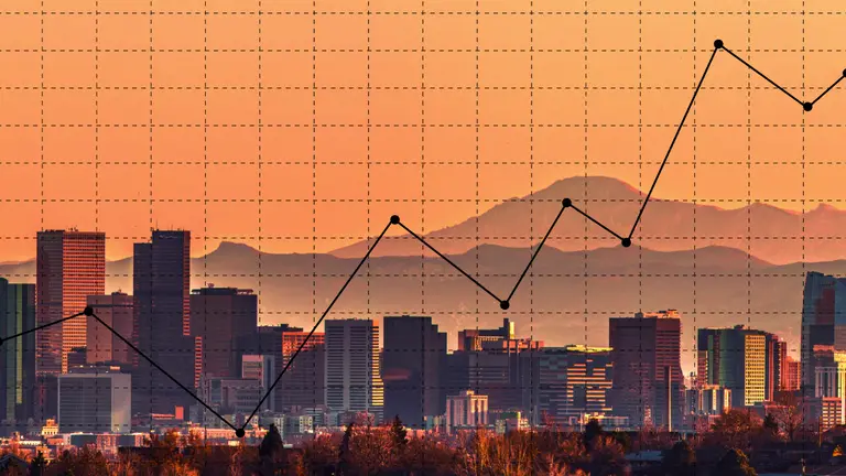 A skyline with a graph overlaid. The whole image is orange and black