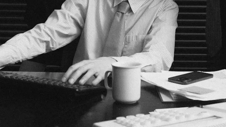 A worker sitting at a desk in the office.
