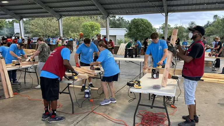 Volunteers in Oxford, Mississippi, take part in Bunks Across America, a national Sleep in Heavenly Peace effort to build beds for children without them. Army of Normal Folks Oxford helped recruit local volunteers for the build.