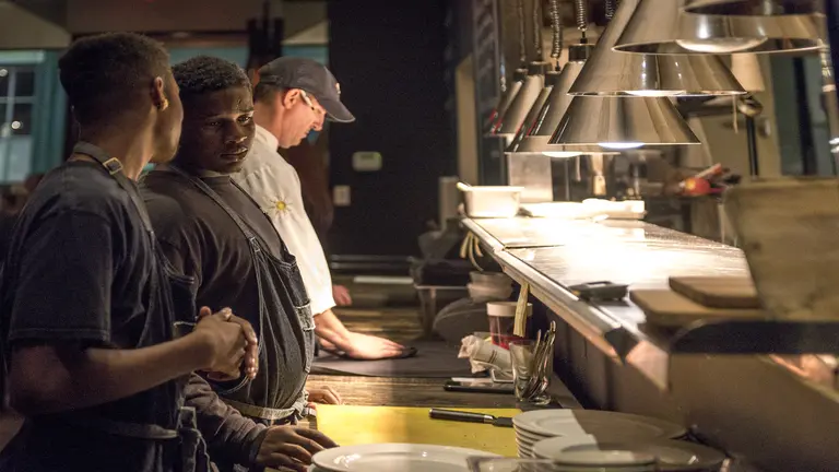 Cafe Momentum interns in a kitchen