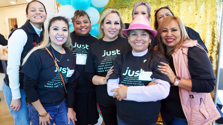 Women wearing Just Branded T-Shirts posing for a photo