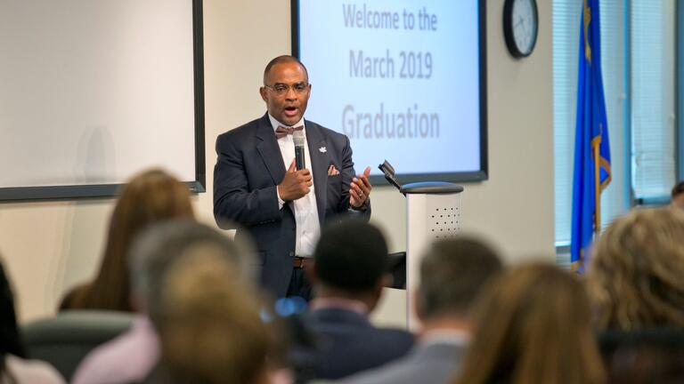 A man giving a presentation to a group of people
