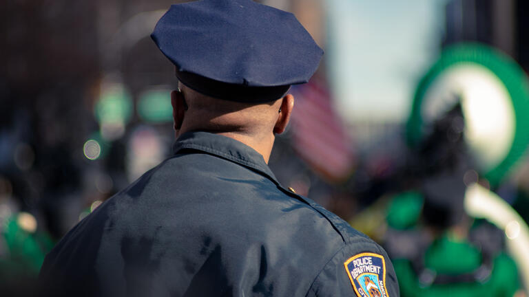 A police officer from behind