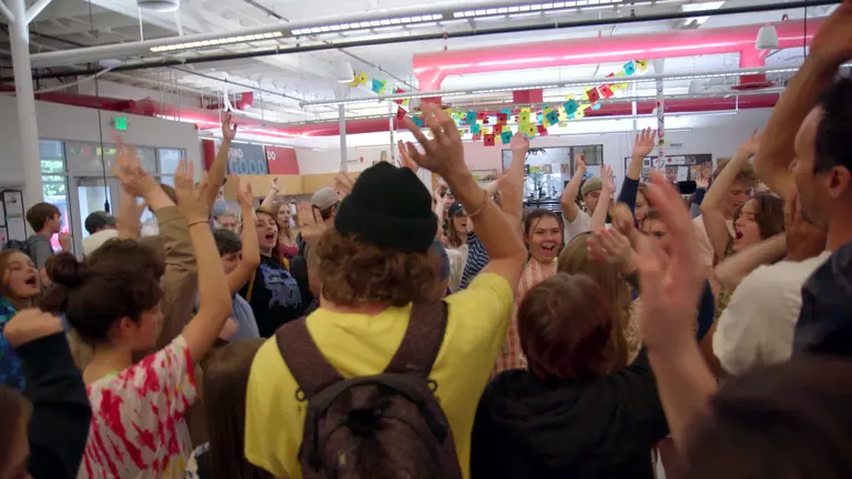 One Stone students raising their hands