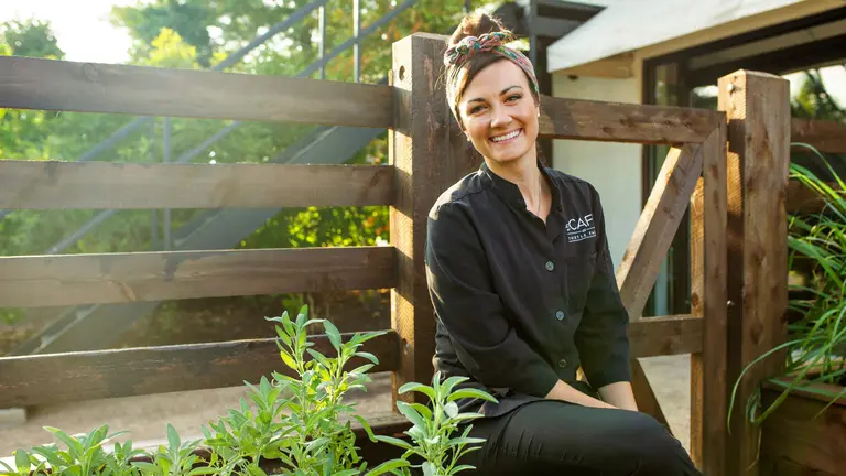 A Thistle Farms Employee poses for a photo
