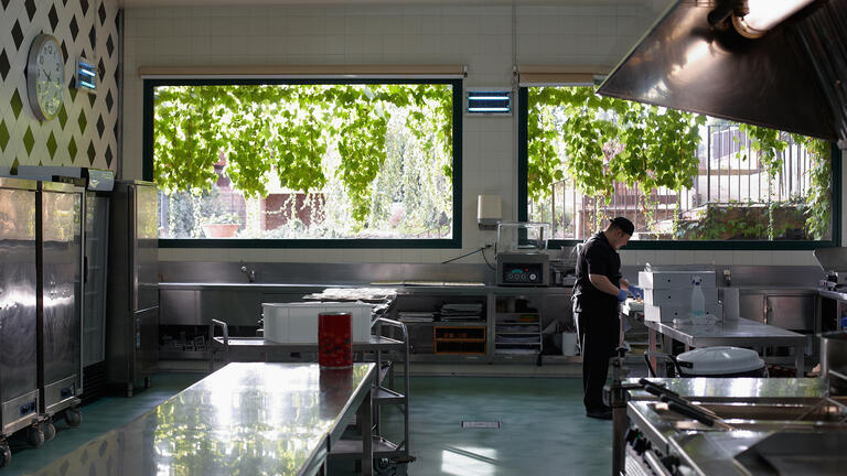 A man working in a kitchen