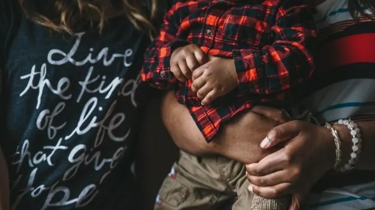 A women holds a baby
