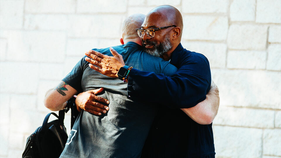 Men embracing